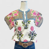 Dames blouse met bloemenborduurwerk en V-hals