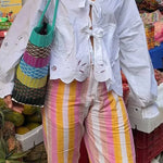 Dames top met elegante pofmouwen en verfijnde lintsluiting voor een vrouwelijke look.