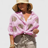 Dames blouse met bladprint en knoopsluiting