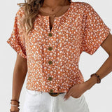 Dames blouse met bloemenprint en knoopdetails