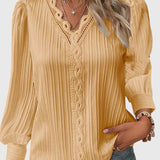 Dames blouse met V-hals en geplooide structuur