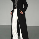 Chaveli lange trenchcoat jas voor dames in elegante stijl met ceintuur en klassieke reverskraag.