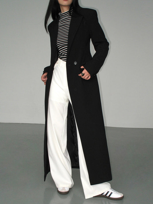Chaveli lange trenchcoat jas voor dames in elegante stijl met ceintuur en klassieke reverskraag.