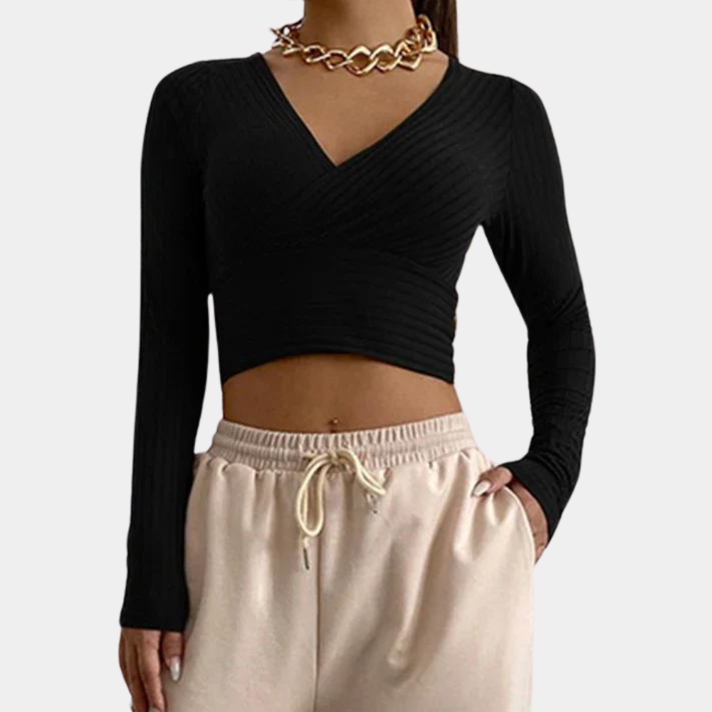Dames crop top met lange mouwen in een trendy, strak model, perfect voor stijlvolle casual en chique outfits.