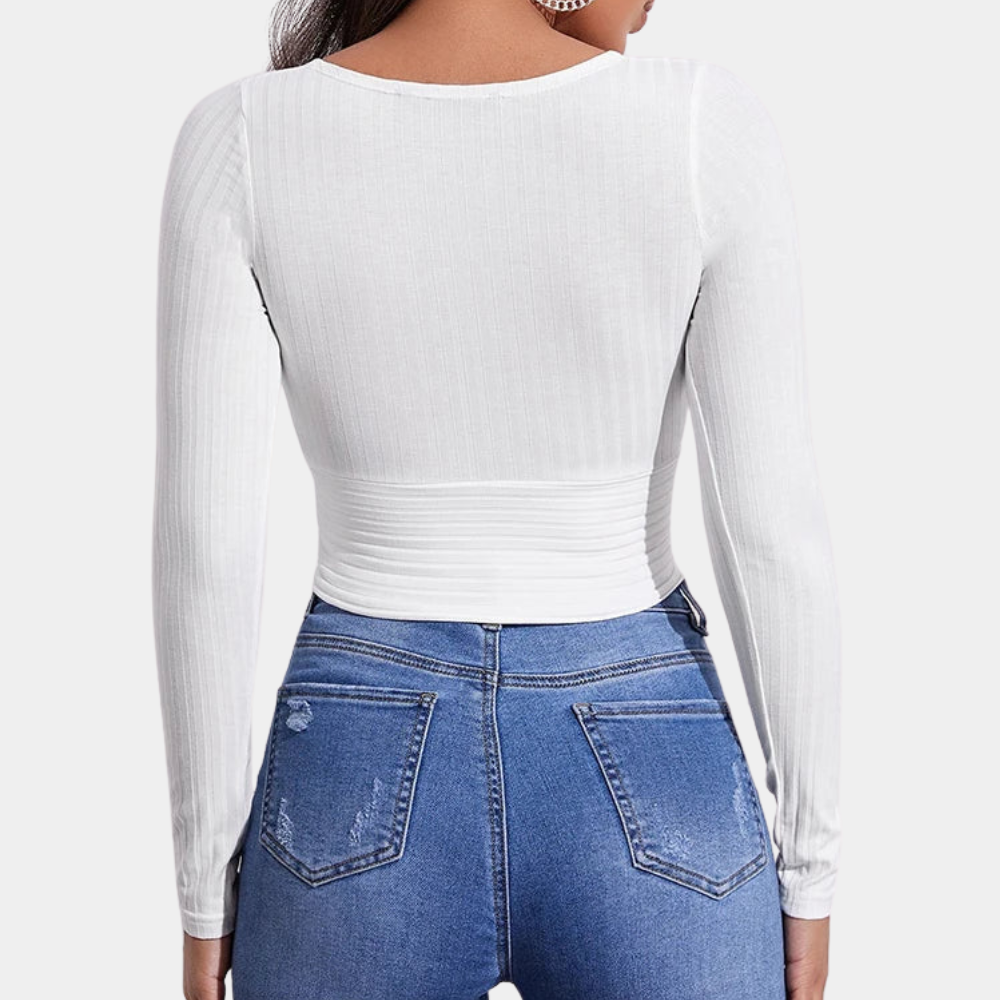 Dames crop top met lange mouwen in een trendy, strak model, perfect voor stijlvolle casual en chique outfits.