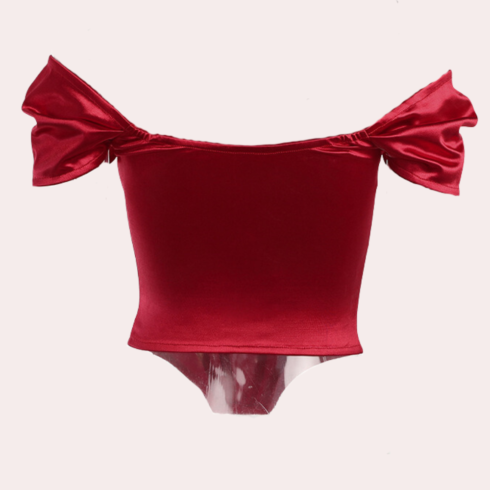 Elegante off‑shoulder zomertop voor dames met luchtige, schoudervrije halslijn en lichtgewicht stof; vrouwelijke, verkoelende must‑have voor stijlvolle zomerlooks.