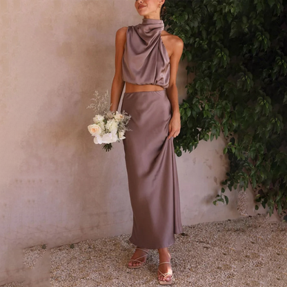 Chaveli satijnen 2-delige set – Luxe maxi rok en top voor dames. Elegante set in satijn met een verfijnde uitstraling, perfect voor chique avonden of speciale gelegenheden. Stijlvol en comfortabel voor een gedurfde, vrouwelijke look.