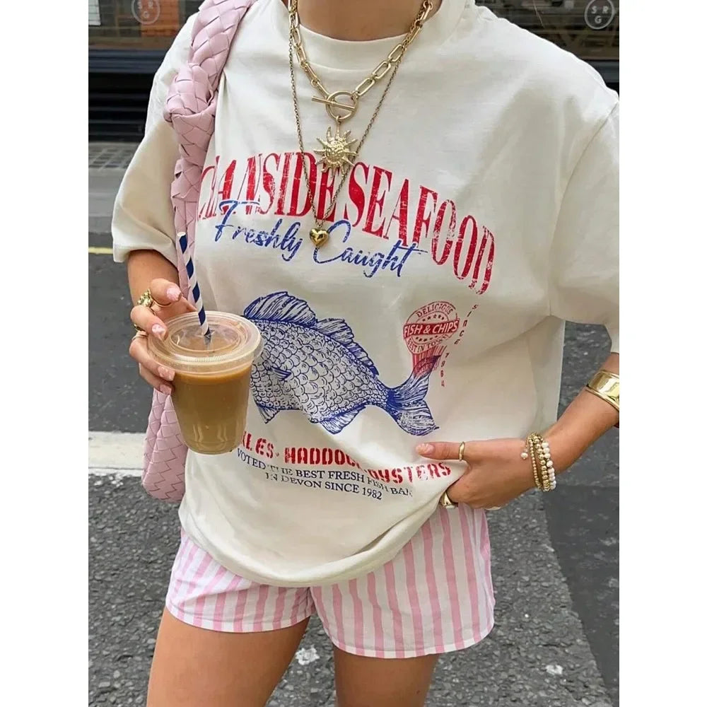 Zomer streetstyle T-shirt voor dames van ademende katoen met comfortabele pasvorm en trendy, casual design.