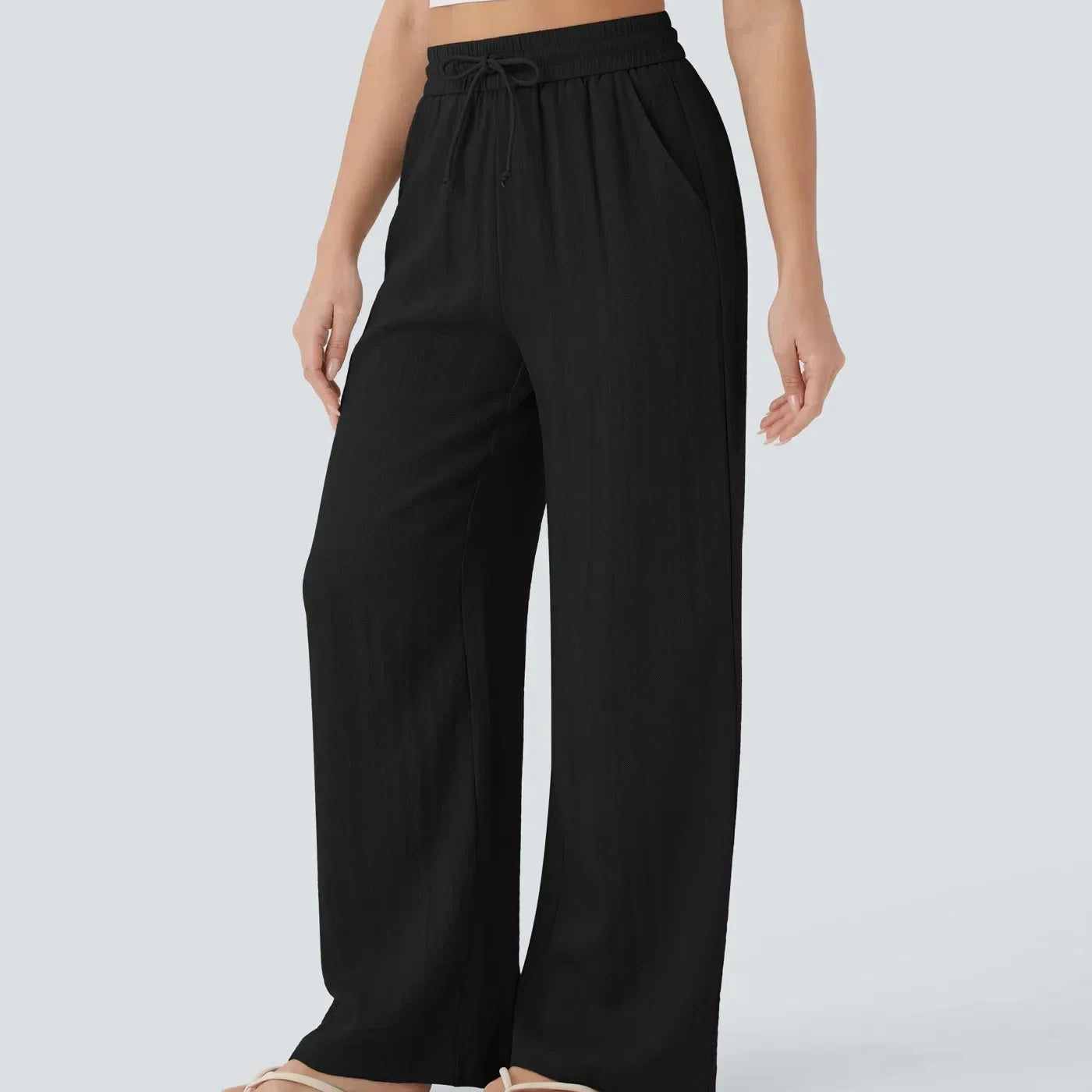 Casual linnen broek voor dames – hoge taille en wijde pijpen voor een luchtige, stijlvolle en comfortabele zomerse look.