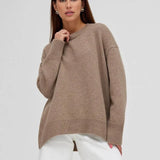 Basic damestrui van kasjmier in een effen kleur, met een tijdloos ontwerp en comfortabele pasvorm – perfect voor een elegante en warme look.