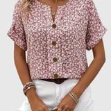 Dames blouse met bloemenprint en knoopdetails