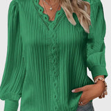 Dames blouse met V-hals en geplooide structuur