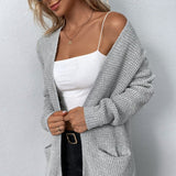 Lange gebreid damesvest in beige – zachte wolmix, comfortabele pasvorm en stijlvolle casual look.