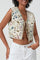 Kort damesgilet met bloemenprint en een striksluiting aan de voorkant, gemaakt van lichtgewicht stof voor een stijlvolle en vrouwelijke look.
