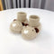 CuddleBear zachte baby slofjes met schattig beertjesmotief – warme, comfortabele en veilige slofjes voor kleine voetjes.
