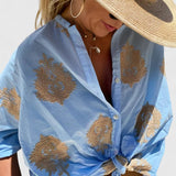 Dames blouse met bladprint en knoopsluiting