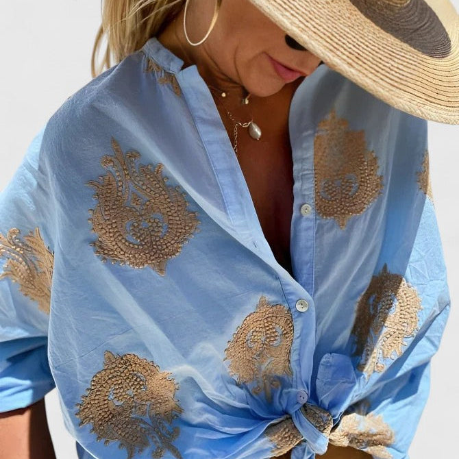 Dames blouse met bladprint en knoopsluiting