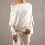 Elegante off-shoulder damestrui in een zachte stof, met lange mouwen en een flatterende pasvorm – ideaal voor een stijlvolle en vrouwelijke look.