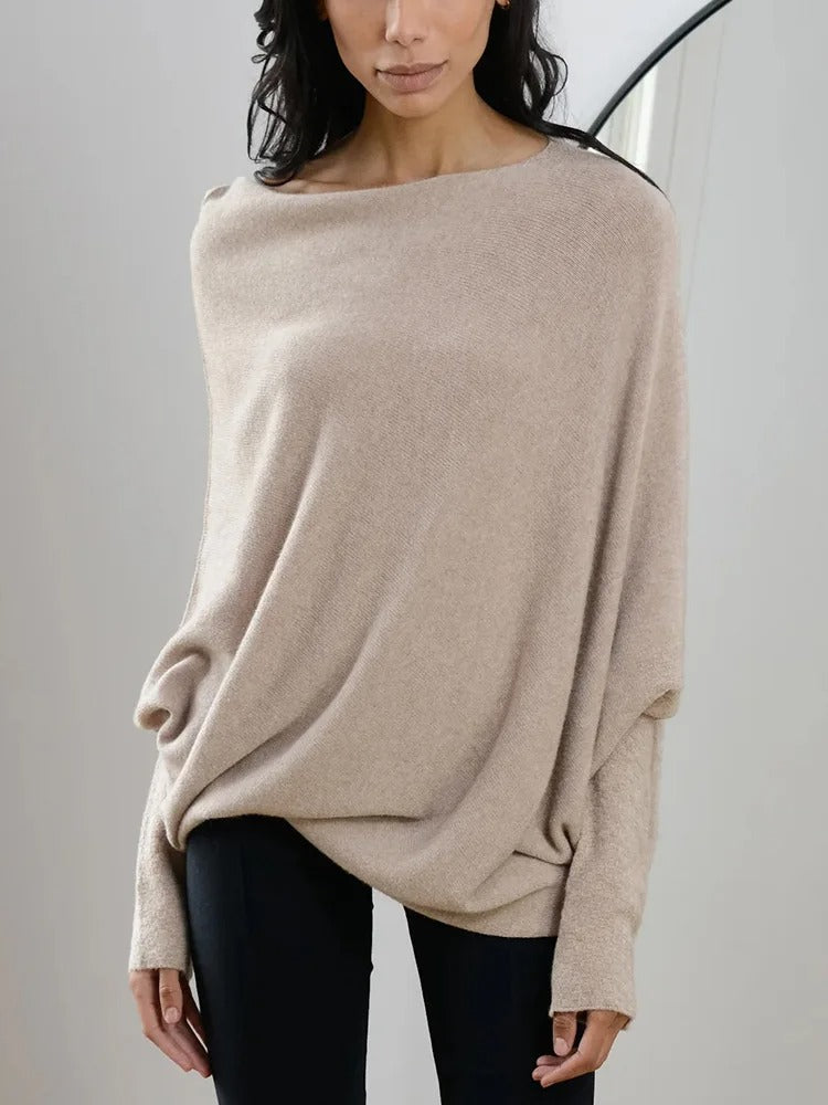 Elegante off-shoulder damestrui in een zachte stof, met lange mouwen en een flatterende pasvorm – ideaal voor een stijlvolle en vrouwelijke look.