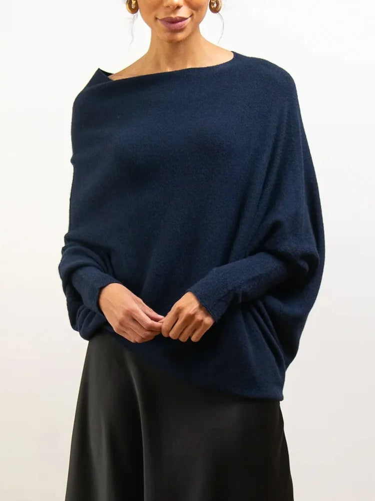 Elegante off-shoulder damestrui in een zachte stof, met lange mouwen en een flatterende pasvorm – ideaal voor een stijlvolle en vrouwelijke look.